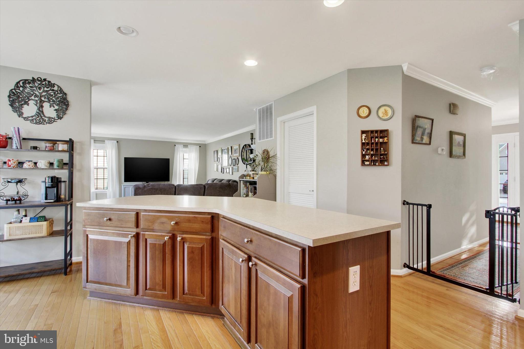 2523 Codorus Lane Spring Grove, PA 17362 - Photo 14 of 53 a kitchen with kitchen island a stove cabinets and wooden floor