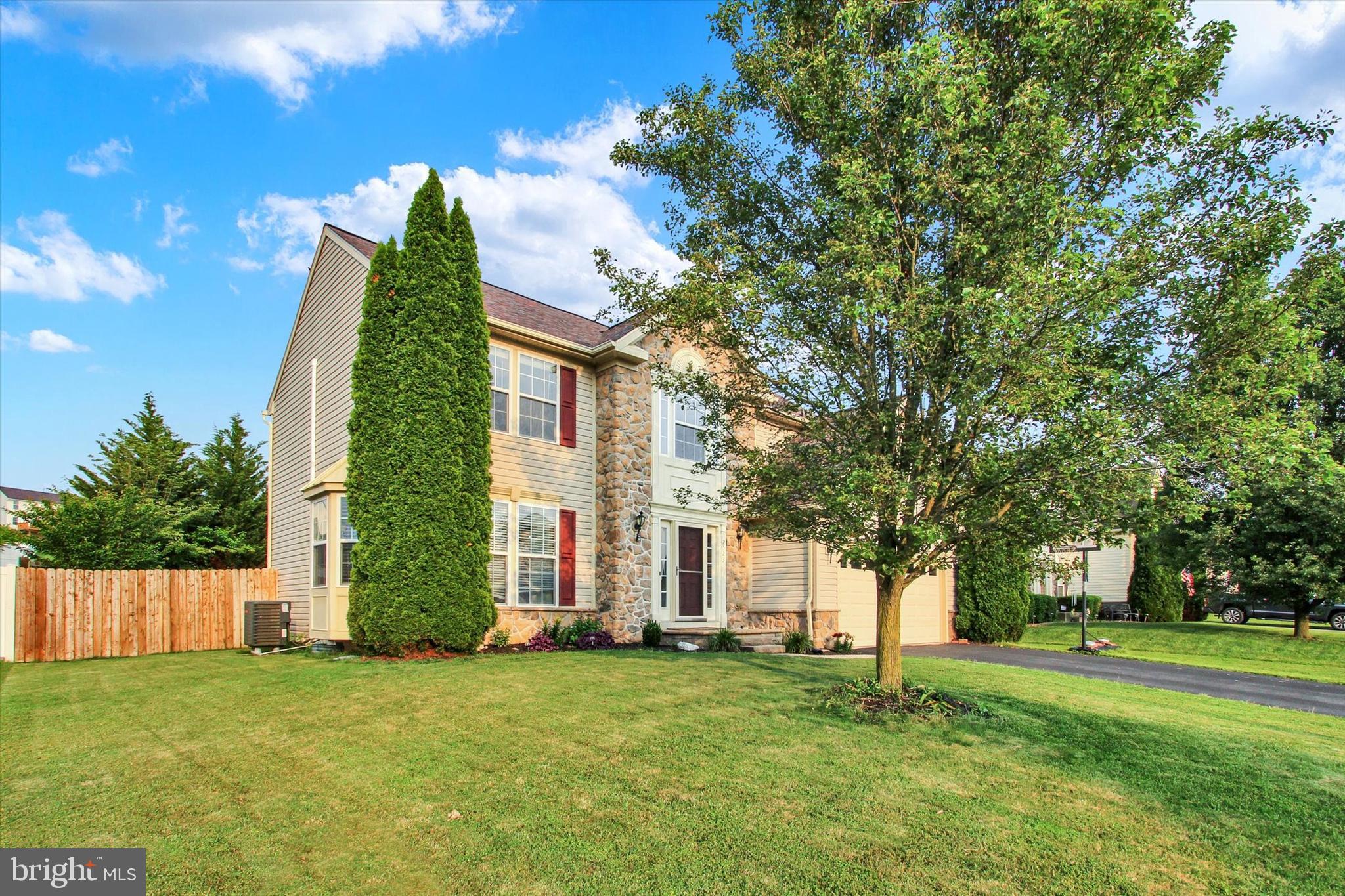 2523 Codorus Lane Spring Grove, PA 17362 - Photo 2 of 53 a front view of a house with a garden