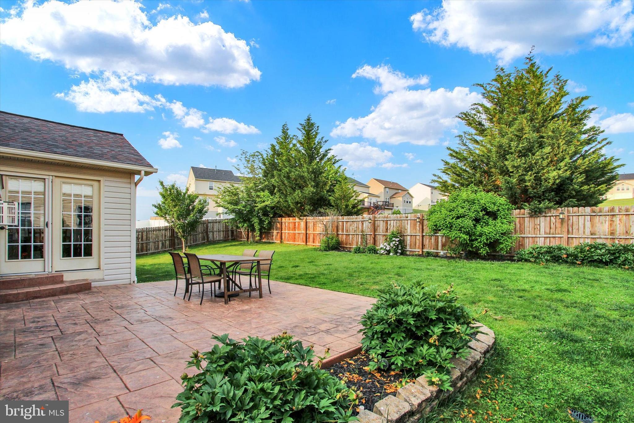 2523 Codorus Lane Spring Grove, PA 17362 - Photo 34 of 53 a view of a house with backyard sitting area and garden