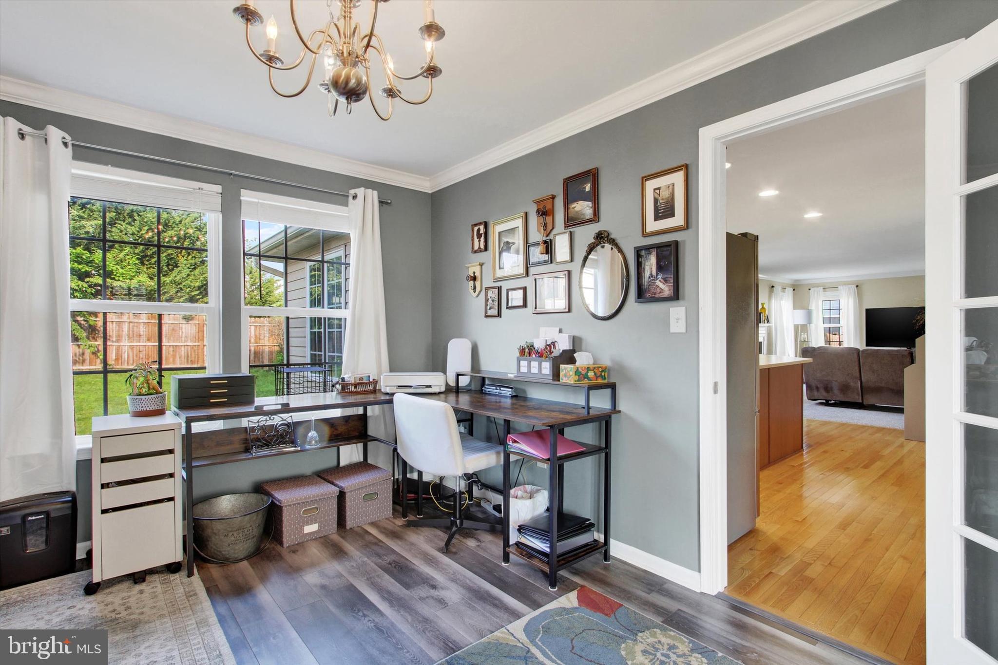 2523 Codorus Lane Spring Grove, PA 17362 - Photo 10 of 53 a view of a dining room and livingroom with furniture wooden floor a chandelier