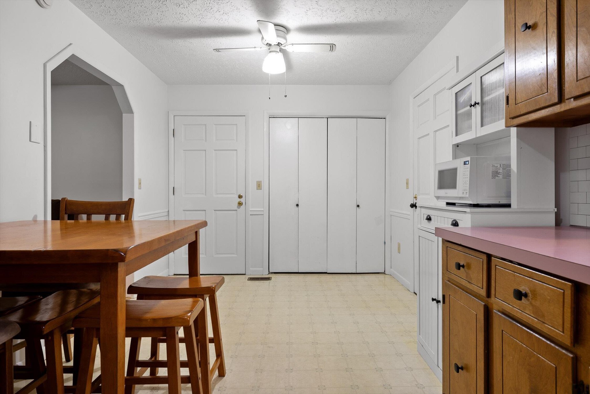 138 Sunset Drive Whitwell, TN 37397 - Photo 12 of 46 a kitchen with cabinets and chairs