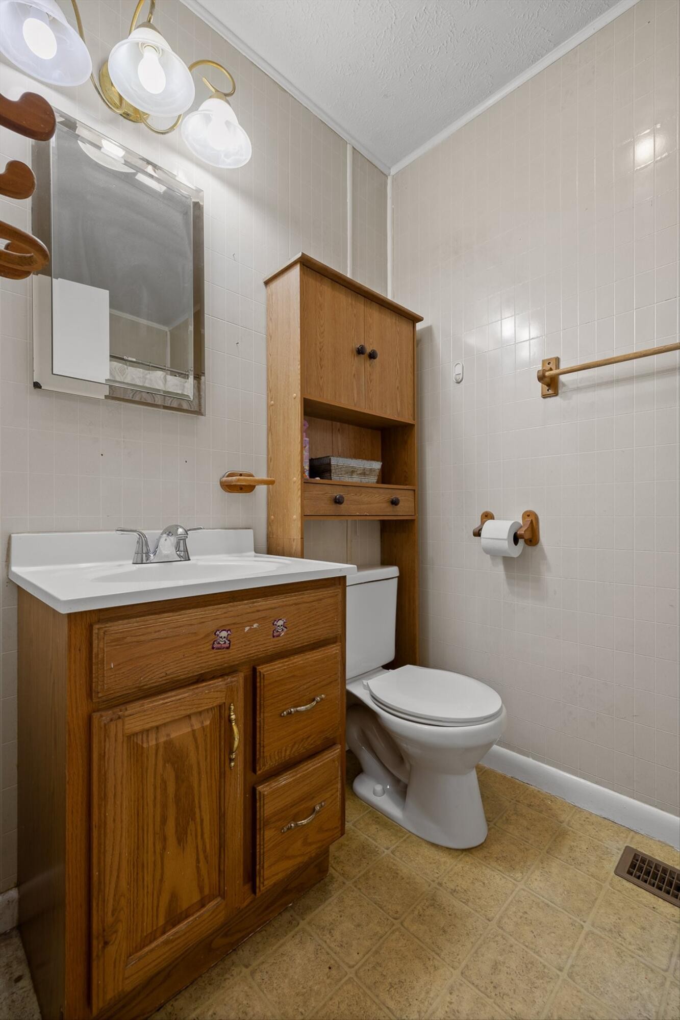 138 Sunset Drive Whitwell, TN 37397 - Photo 15 of 46 a bathroom with a granite countertop toilet sink and mirror