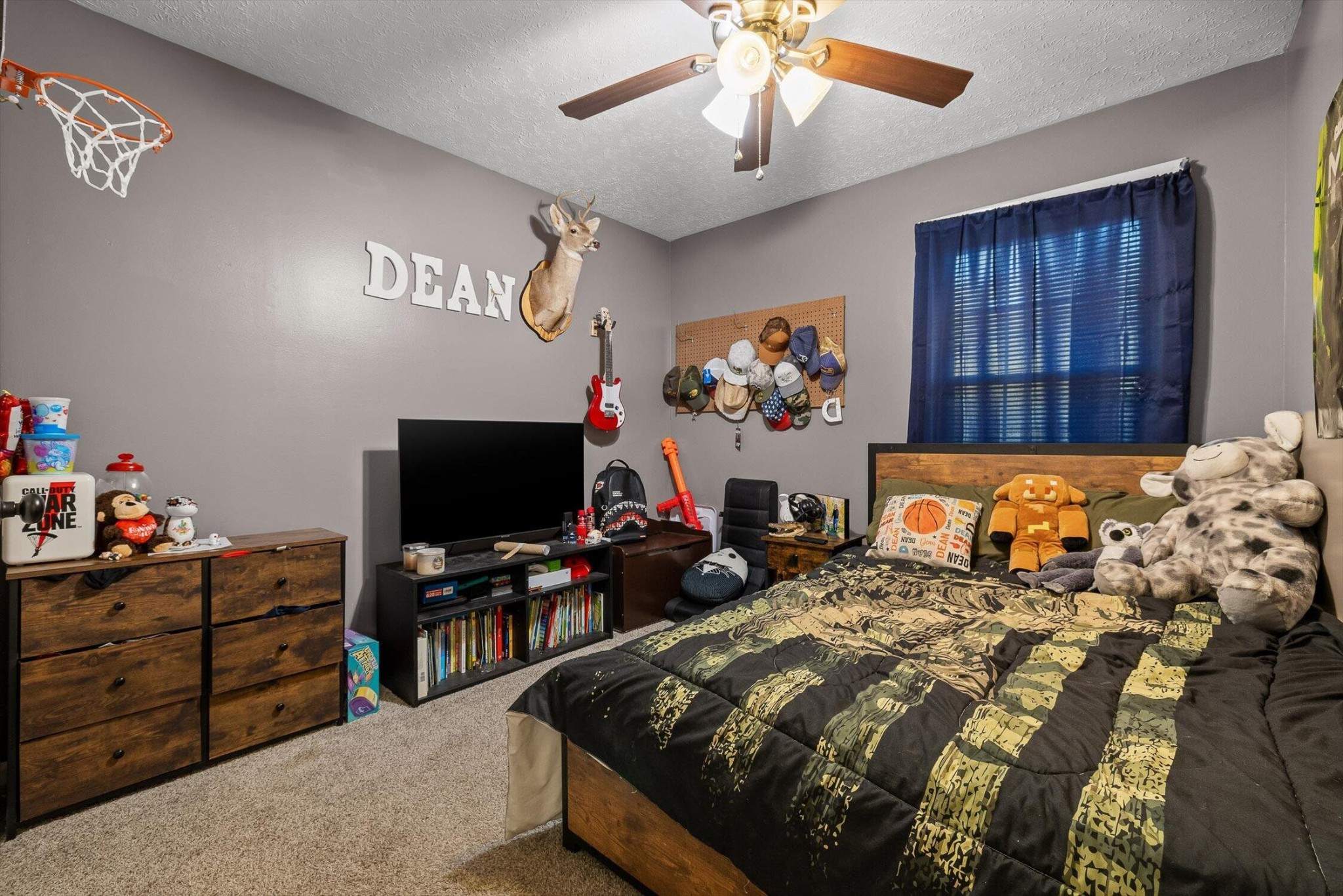 138 Sunset Drive Whitwell, TN 37397 - Photo 17 of 46 a bedroom with bed and a flat tv screen on dresser