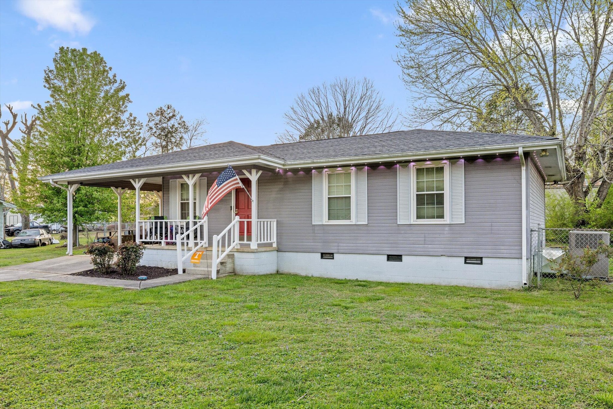 138 Sunset Drive Whitwell, TN 37397 - Photo 20 of 46 a front view of a house with garden and porch