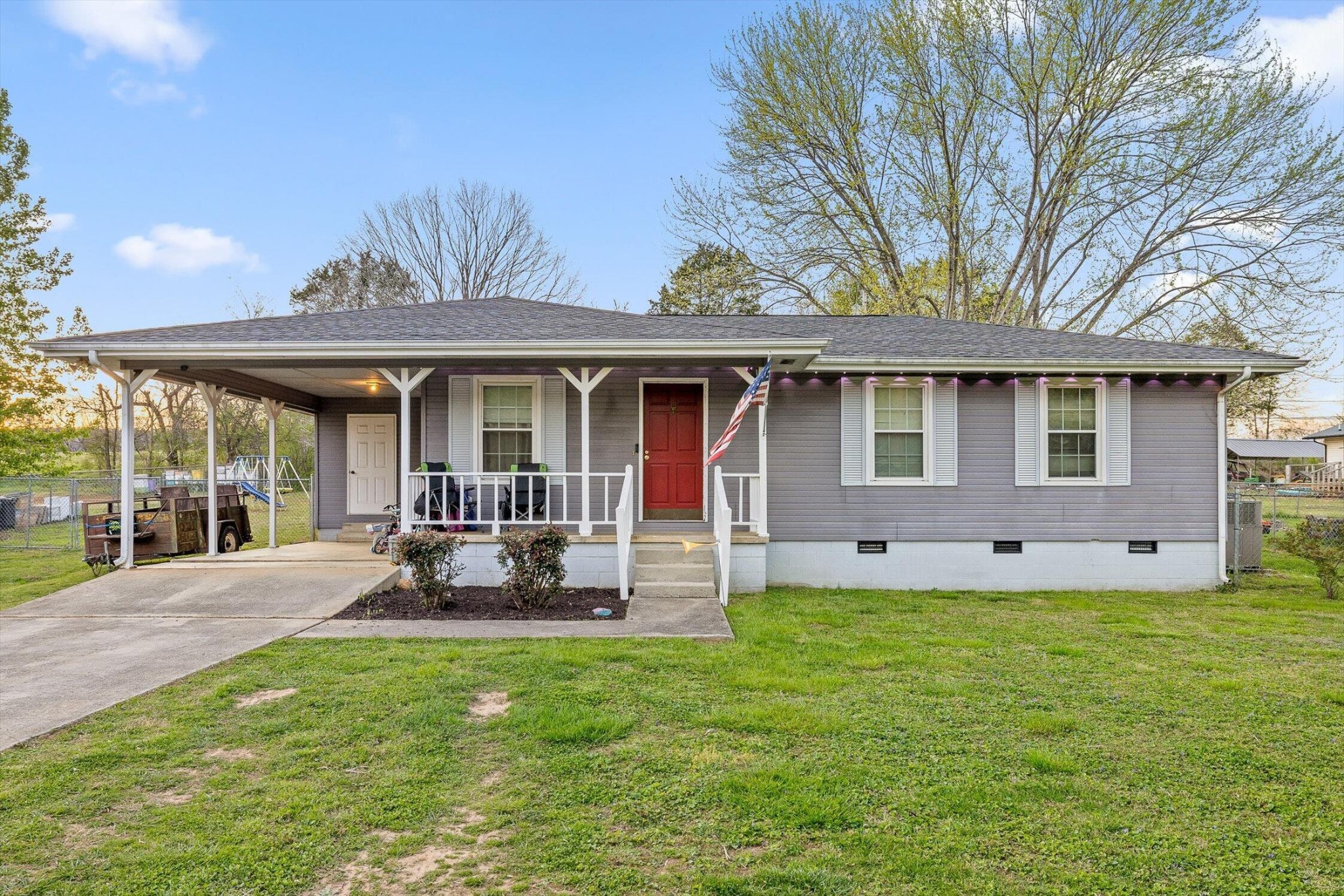 138 Sunset Drive Whitwell, TN 37397 - Photo 2 of 46 a front view of a house with a yard and porch