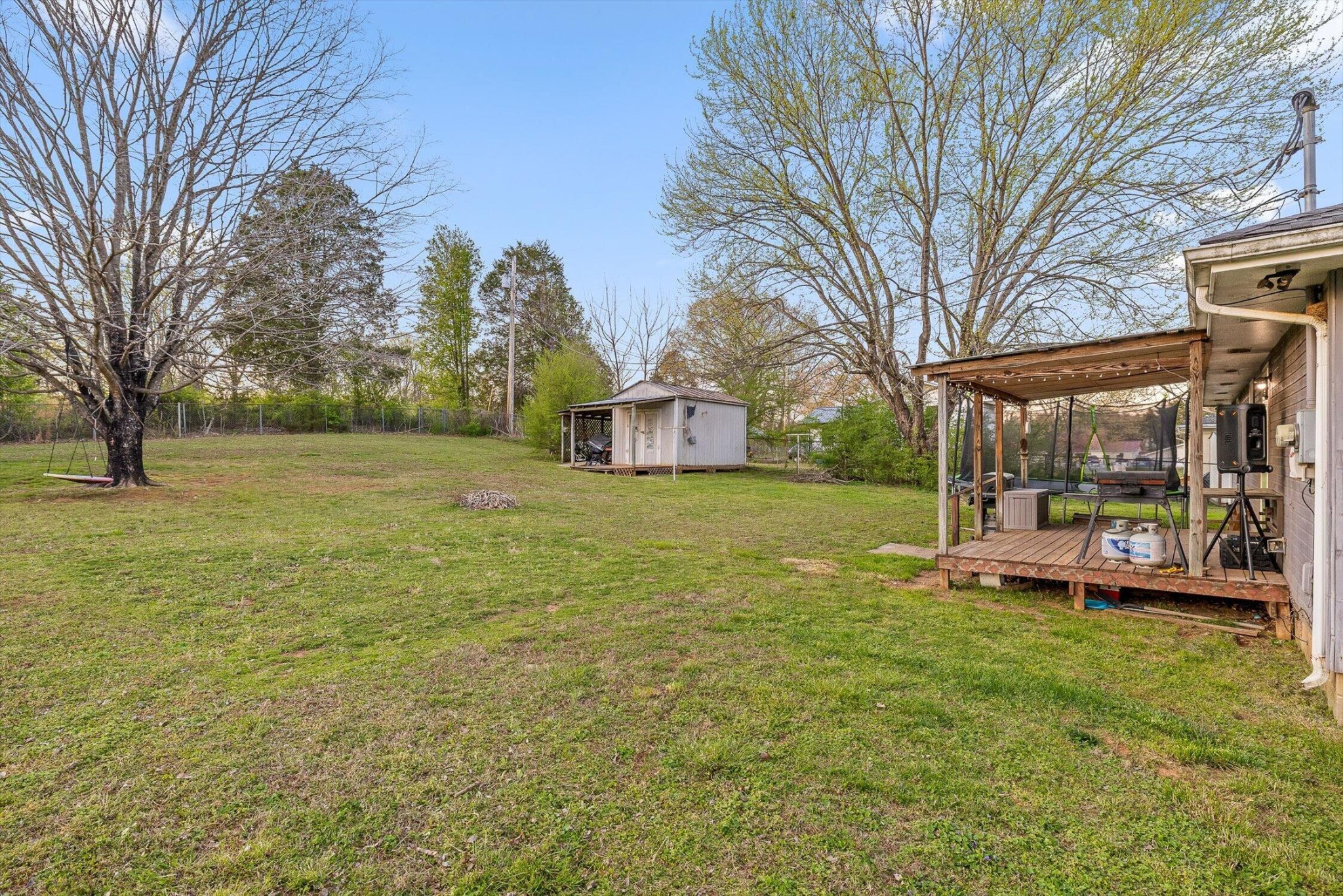 138 Sunset Drive Whitwell, TN 37397 - Photo 22 of 46 a view of a house with a big yard and large trees