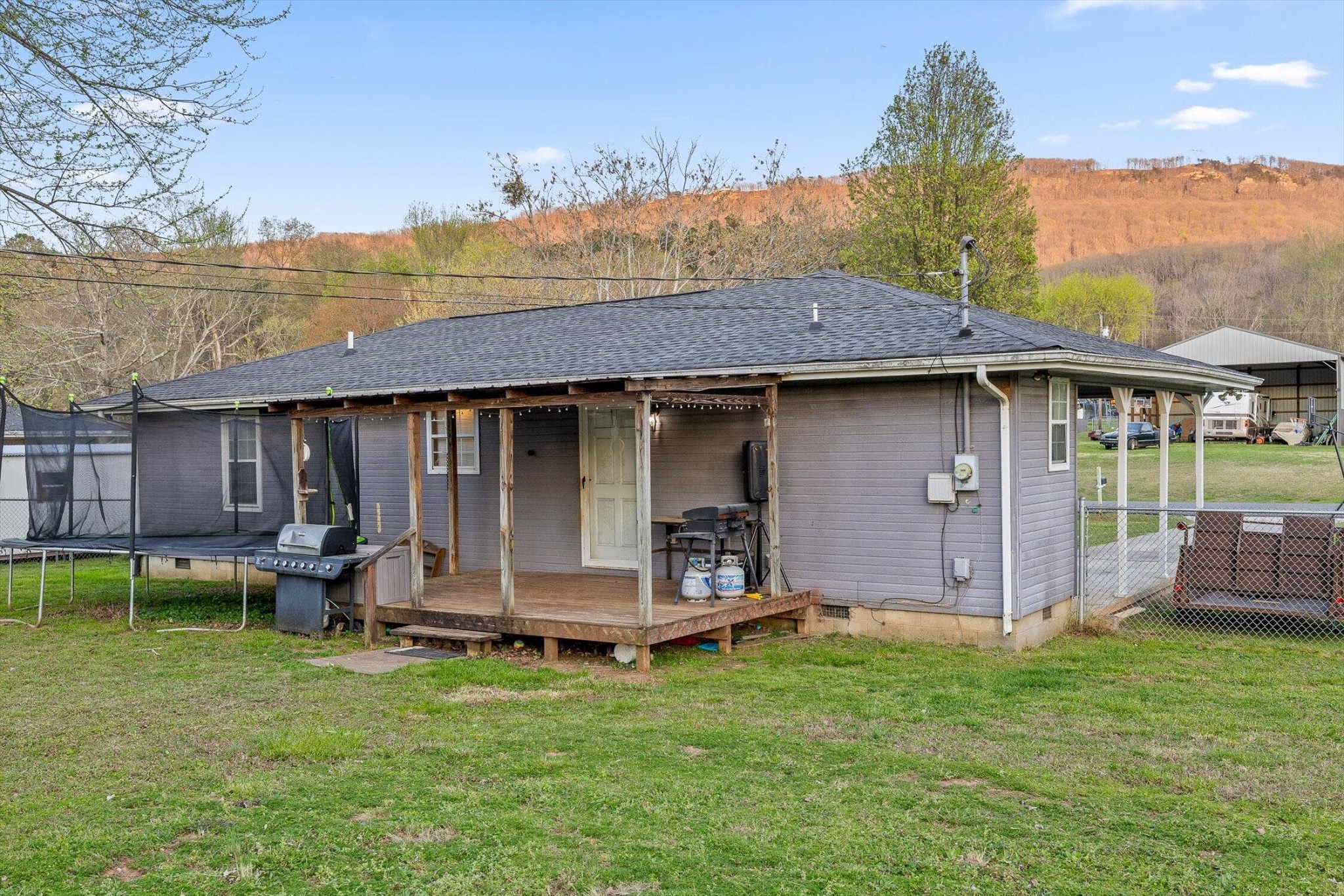 138 Sunset Drive Whitwell, TN 37397 - Photo 23 of 46 a view of a house with a yard and sitting area