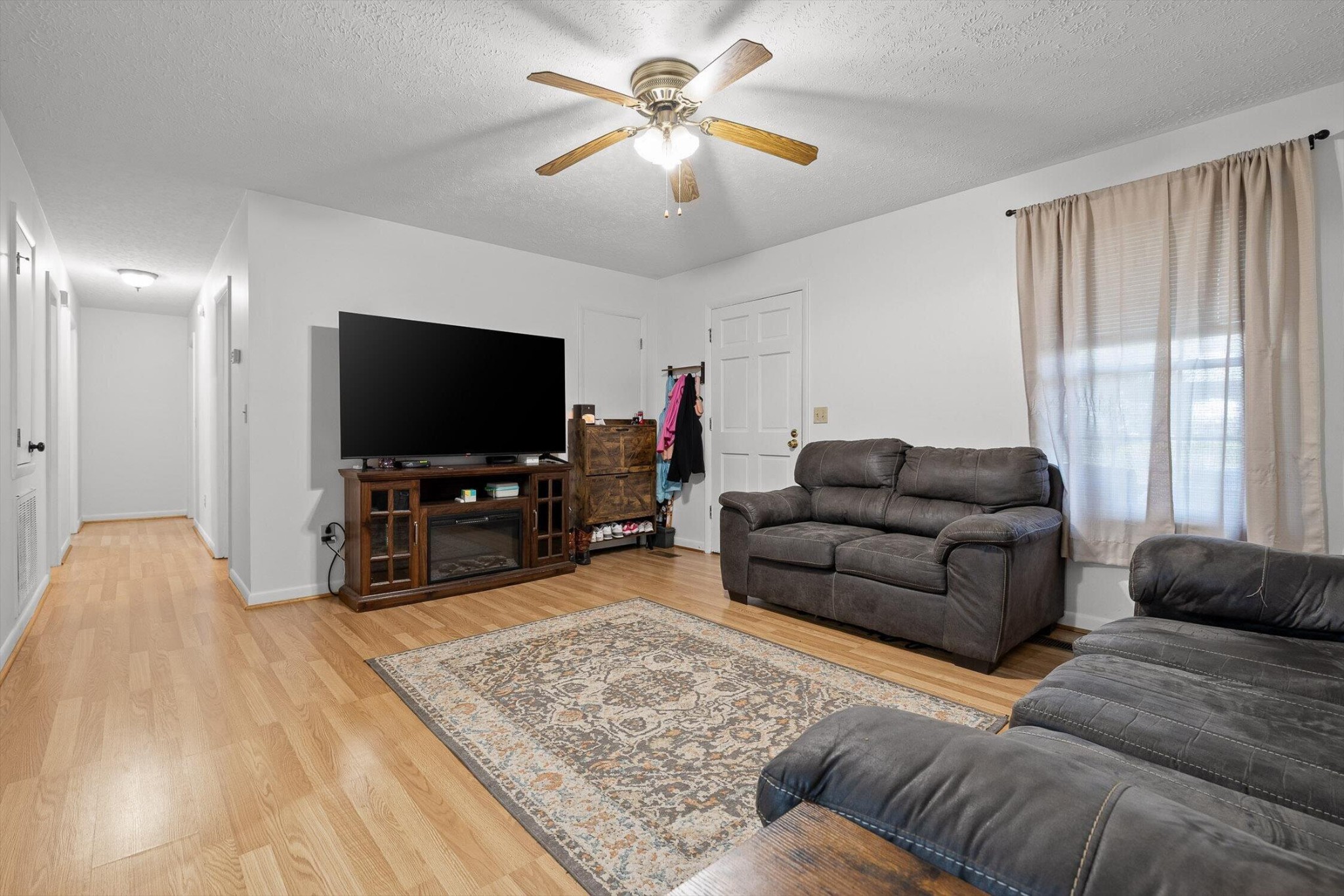 138 Sunset Drive Whitwell, TN 37397 - Photo 3 of 46 a living room with furniture and a flat screen tv