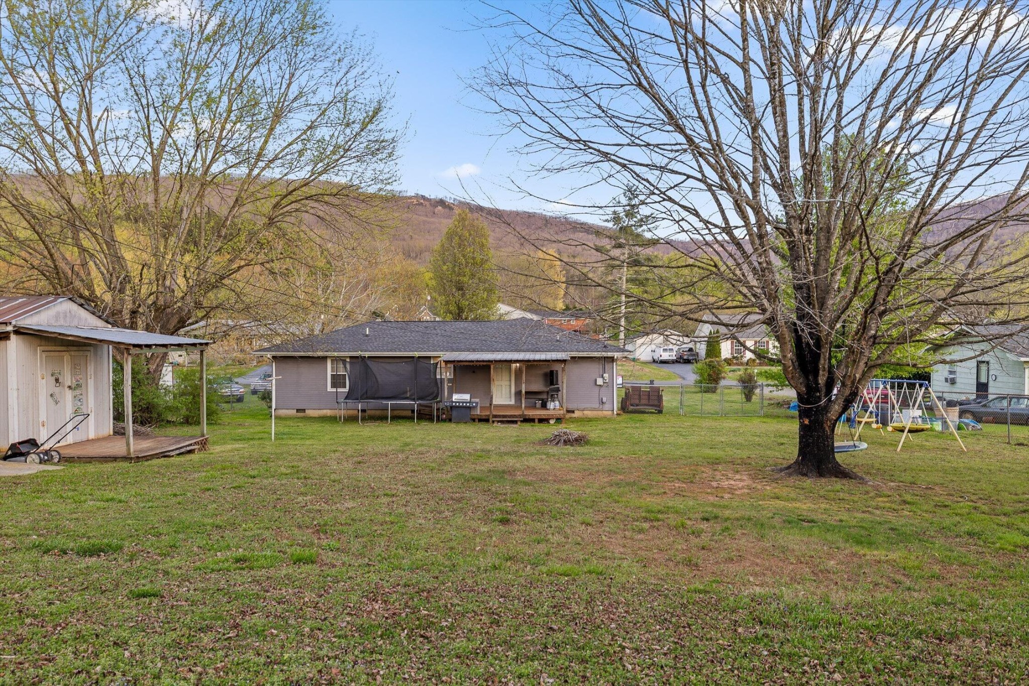 138 Sunset Drive Whitwell, TN 37397 - Photo 33 of 46 a view of a yard in front of a house with large trees