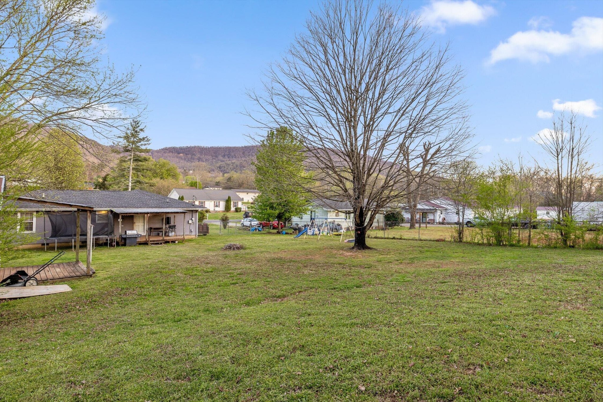 138 Sunset Drive Whitwell, TN 37397 - Photo 34 of 46 a view of a big yard in front of the house