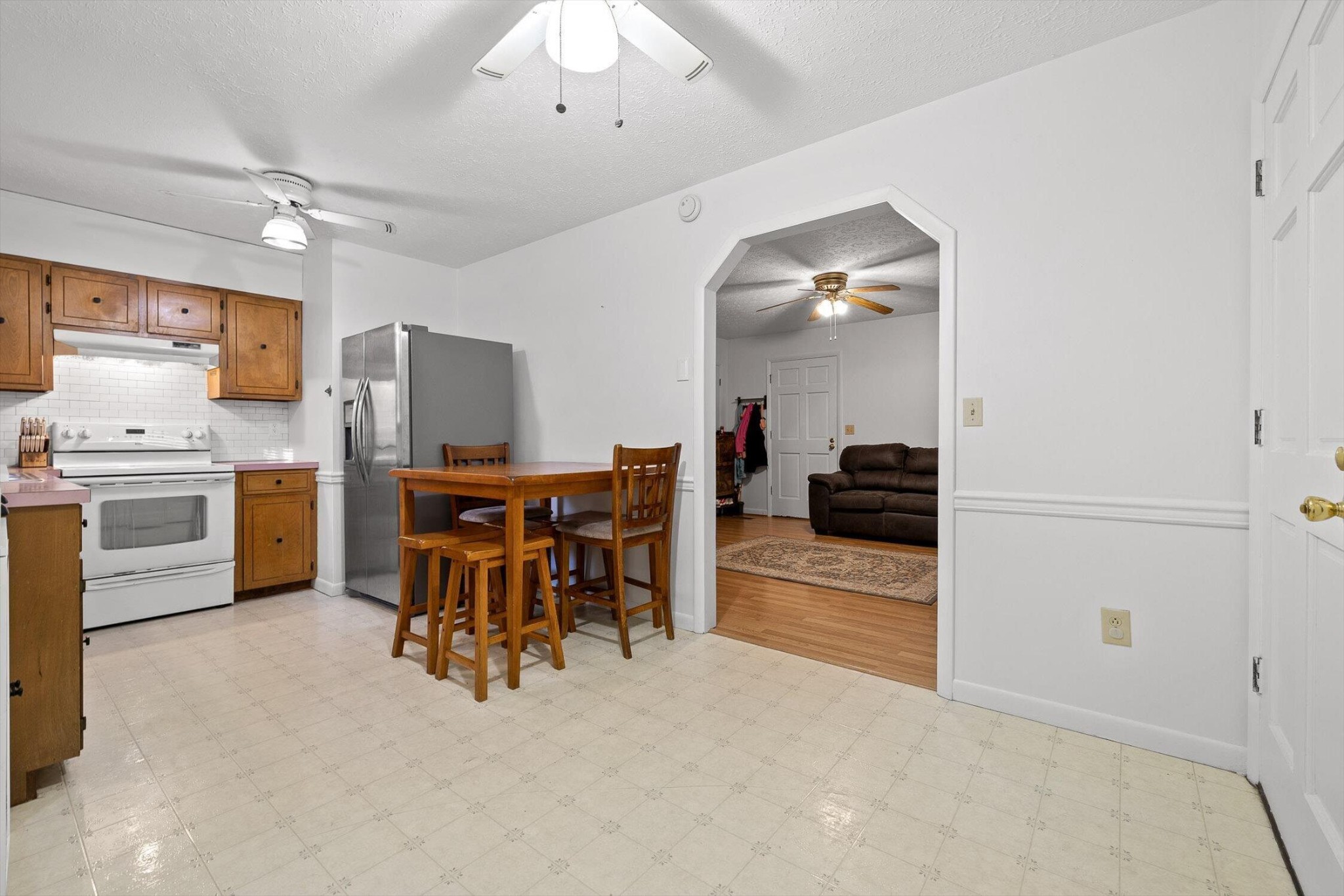 138 Sunset Drive Whitwell, TN 37397 - Photo 8 of 46 a view of kitchen with refrigerator microwave and chairs