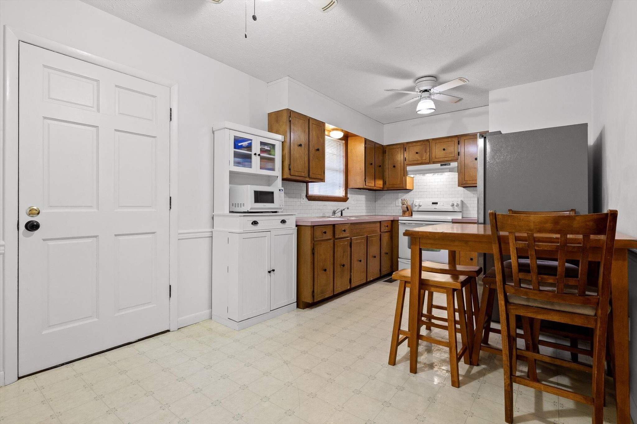138 Sunset Drive Whitwell, TN 37397 - Photo 10 of 46 a view of kitchen with sink microwave and dining area