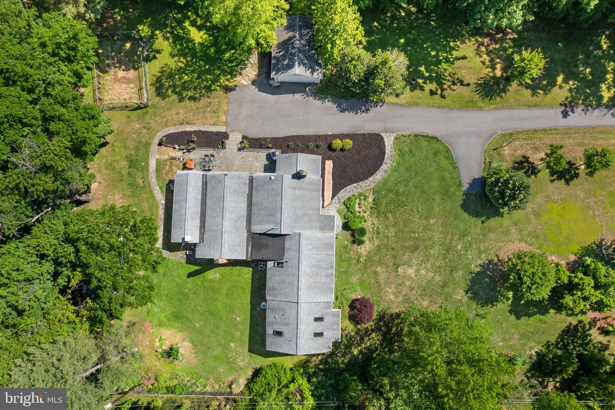 815 Seneca Road Great Falls, VA 22066 - Photo 52 of 61 an aerial view of a house with swimming pool and large trees