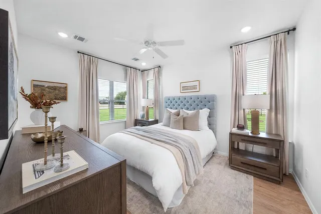 a bedroom with a bed and a table