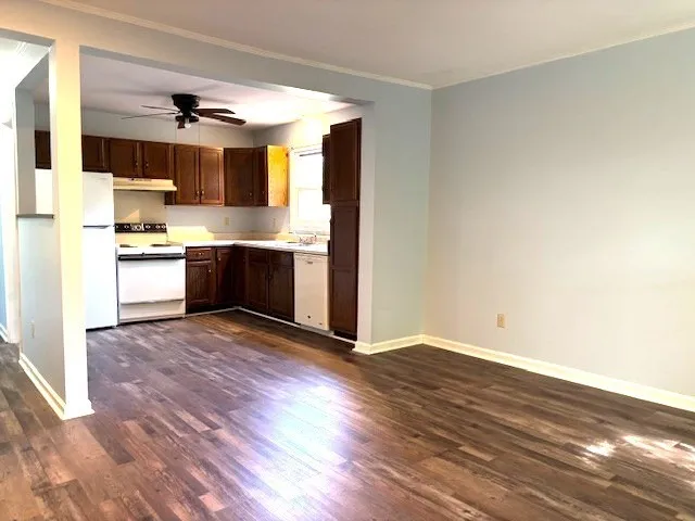a kitchen with stainless steel appliances granite countertop a stove and a refrigerator