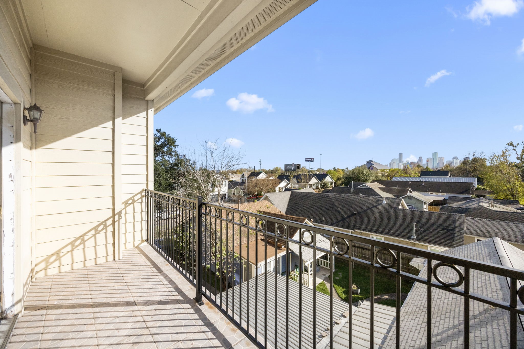 609 Gardner Street Houston, TX 77009 - Photo 21 of 31 a view of a balcony with wooden chairs