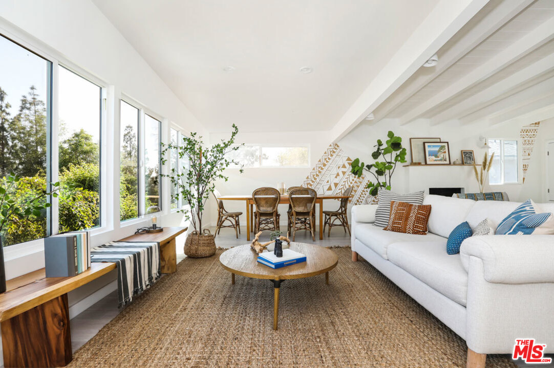 3922 Roderick Road Los Angeles, CA 90065 - Photo 1 of 29 a living room with furniture and a large window