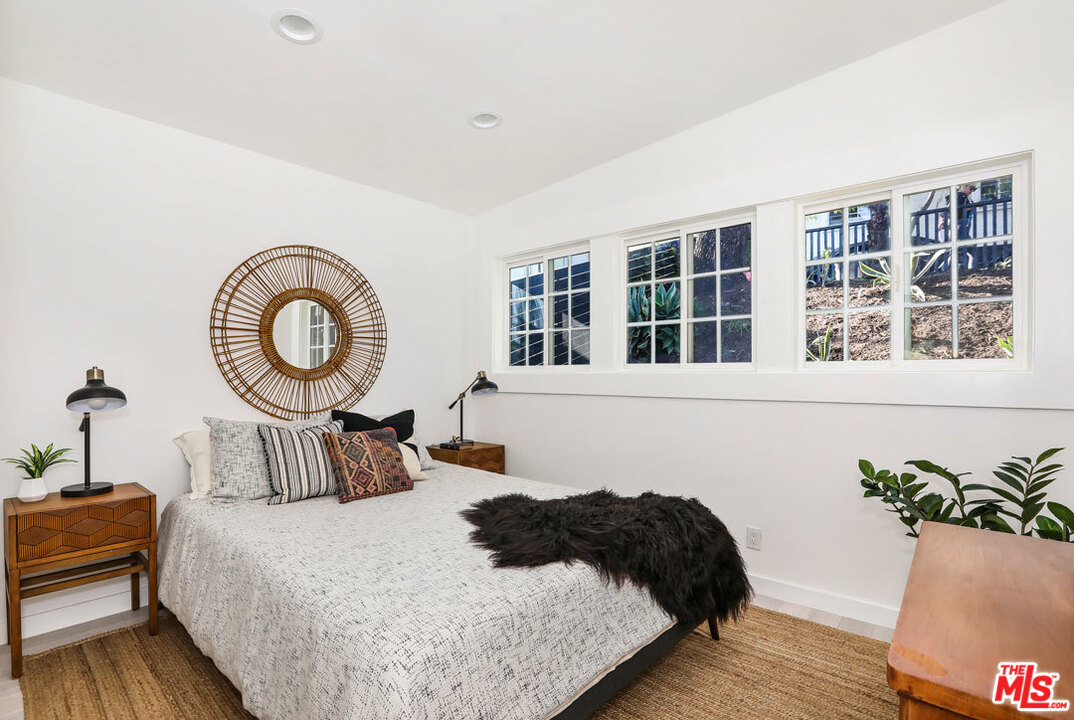 3922 Roderick Road Los Angeles, CA 90065 - Photo 13 of 29 a bedroom with a bed and window