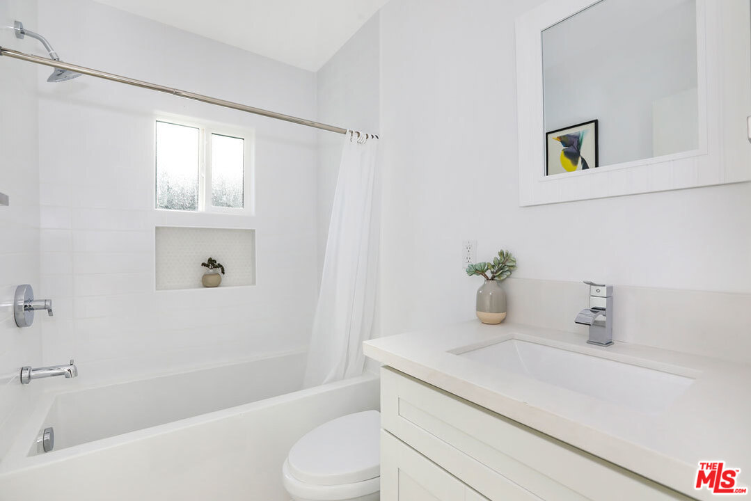3922 Roderick Road Los Angeles, CA 90065 - Photo 14 of 29 a bathroom with a sink a toilet and shower