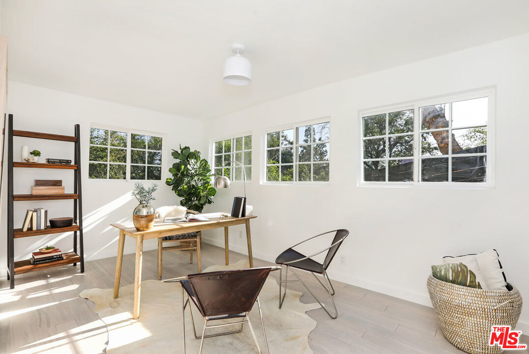 3922 Roderick Road Los Angeles, CA 90065 - Photo 20 of 29 a living room with furniture and a potted plant