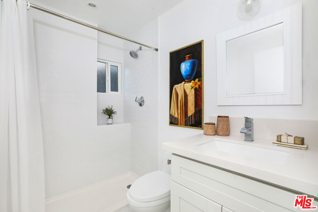 3922 Roderick Road Los Angeles, CA 90065 - Photo 22 of 29 a bathroom with a sink toilet and shower