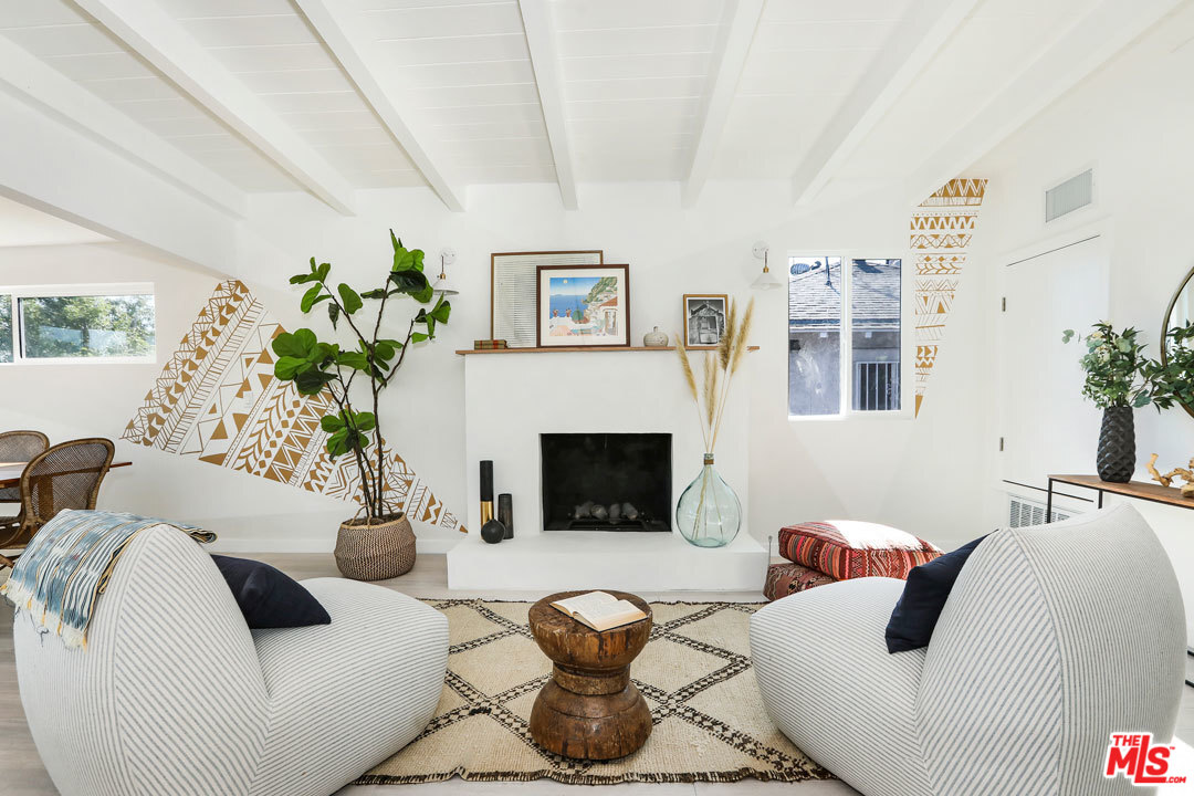 3922 Roderick Road Los Angeles, CA 90065 - Photo 6 of 29 a living room with furniture potted plant and a fireplace