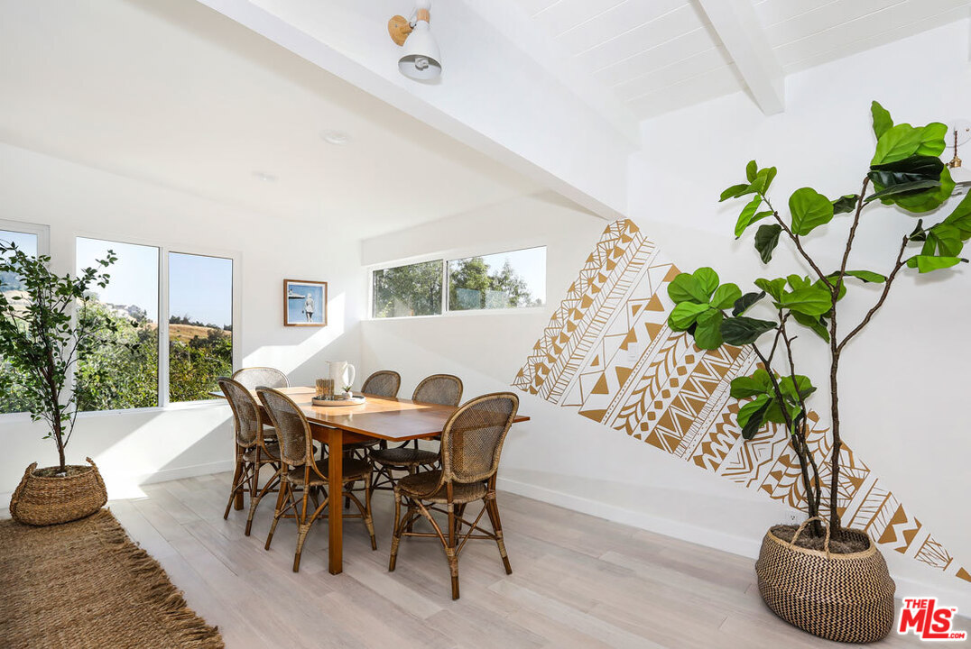 3922 Roderick Road Los Angeles, CA 90065 - Photo 7 of 29 a view of a dining room with furniture and a potted plant
