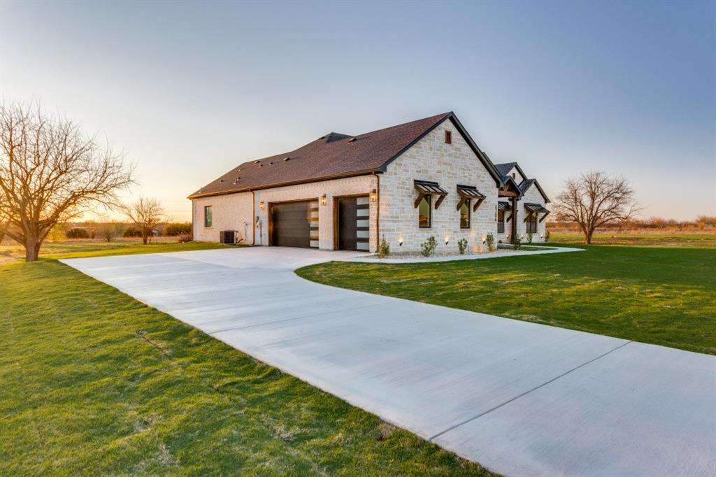 6306 Starlight Ranch Road Godley, TX 76044 - Photo 4 of 40 3-car garage and a long driveway