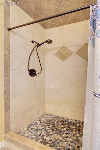 17879 Pinon Park Road Peyton, CO 80831 - Photo 14 of 26 Master Bedroom tiled shower.