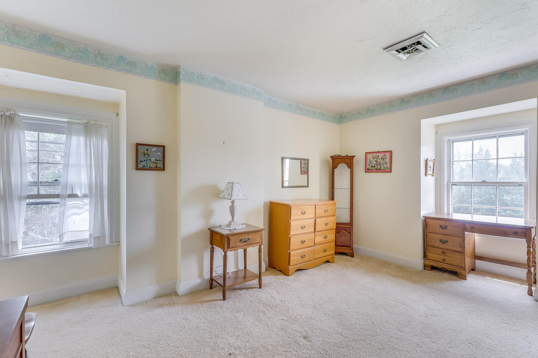 3420 Main Street, Unit 3 Barnstable, MA 02630 - Photo 17 of 28 a view of a bedroom with furniture and windows