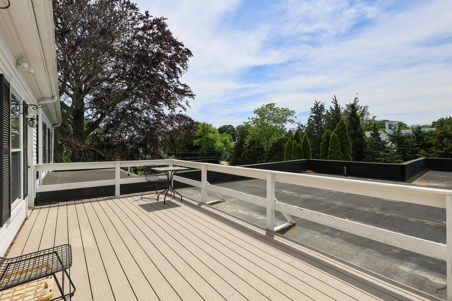 3420 Main Street, Unit 3 Barnstable, MA 02630 - Photo 20 of 28 a view of balcony with deck and wooden floor