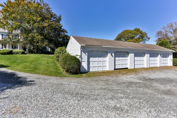 3420 Main Street, Unit 3 Barnstable, MA 02630 - Photo 22 of 28 a front view of a house with a yard