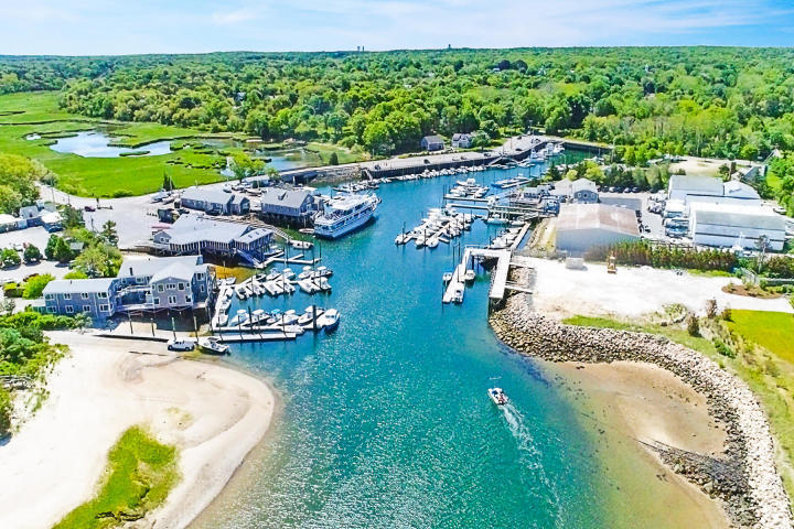 3420 Main Street, Unit 3 Barnstable, MA 02630 - Photo 28 of 28 an aerial view of a house with a garden and lake view