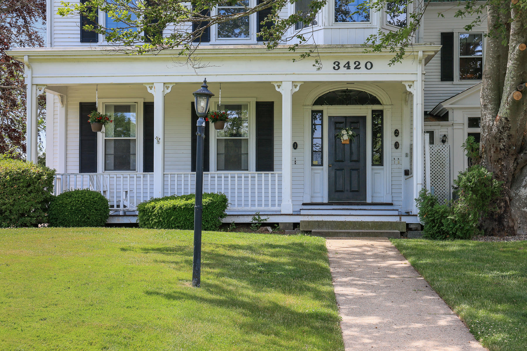 3420 Main Street, Unit 3 Barnstable, MA 02630 - Photo 4 of 28 a view of a house with garden