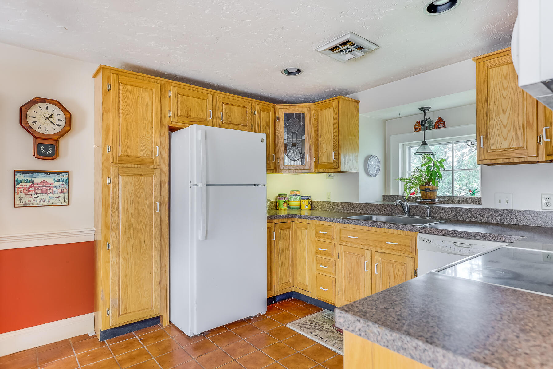 3420 Main Street, Unit 3 Barnstable, MA 02630 - Photo 10 of 28 a kitchen with stainless steel appliances granite countertop a refrigerator a stove and a sink with granite countertops