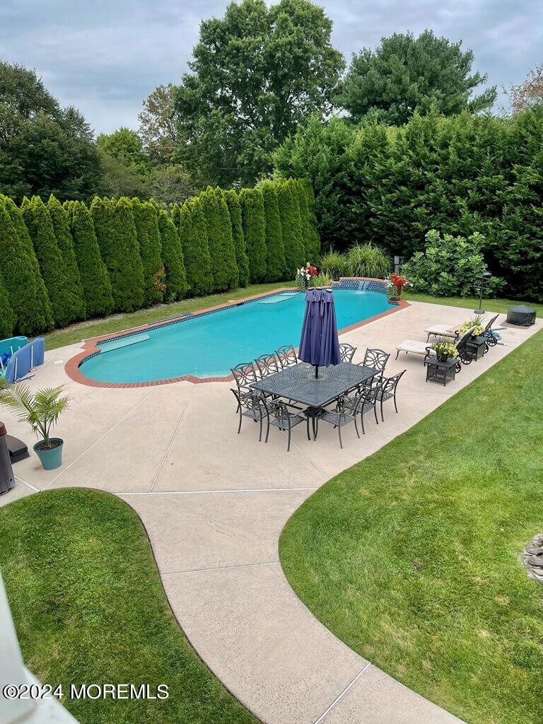 762 Adelphia Road Freehold, NJ 07728 - Photo 38 of 56 a view of a swimming pool with a patio