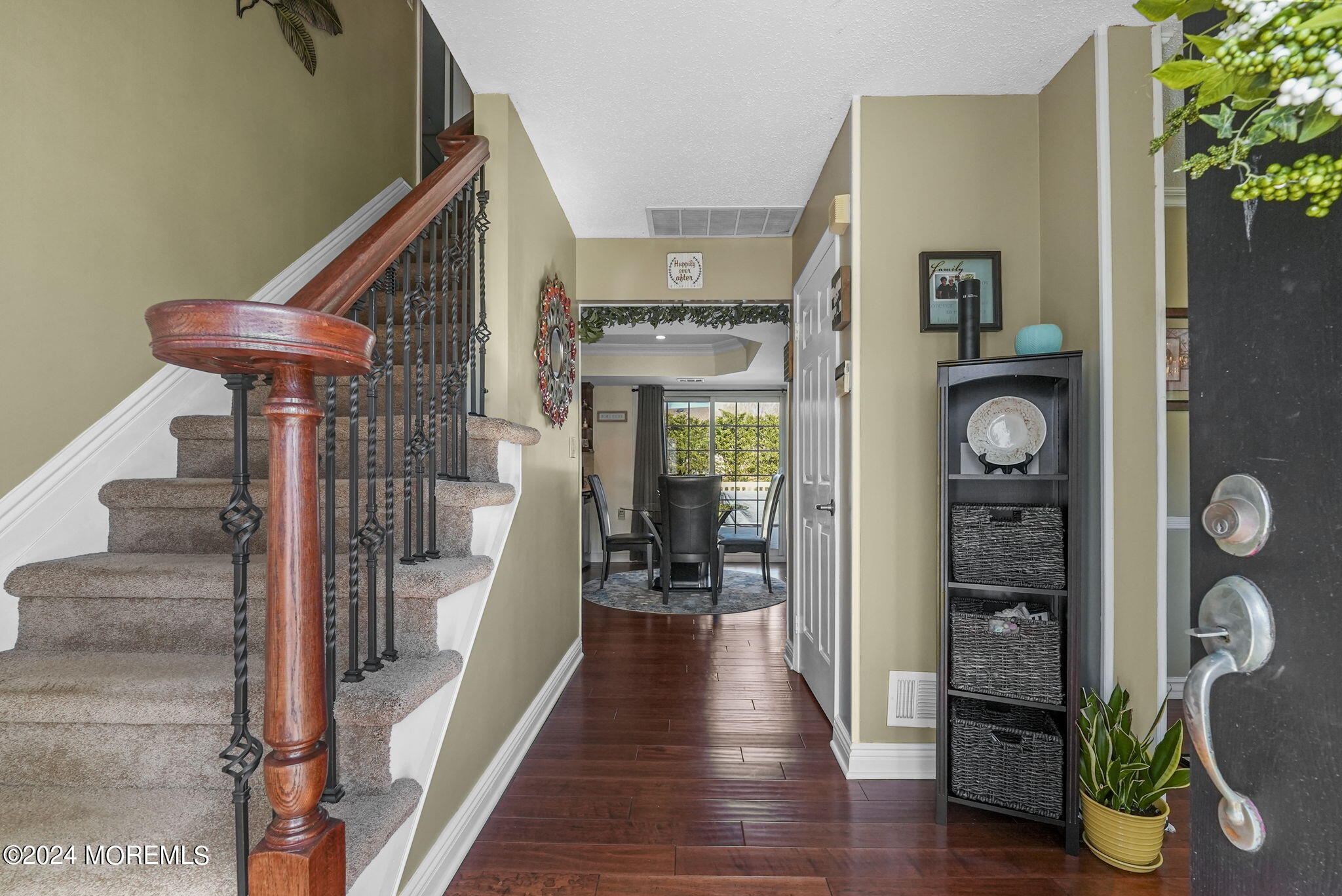 762 Adelphia Road Freehold, NJ 07728 - Photo 5 of 56 a view of a hallway with wooden floor and staircase