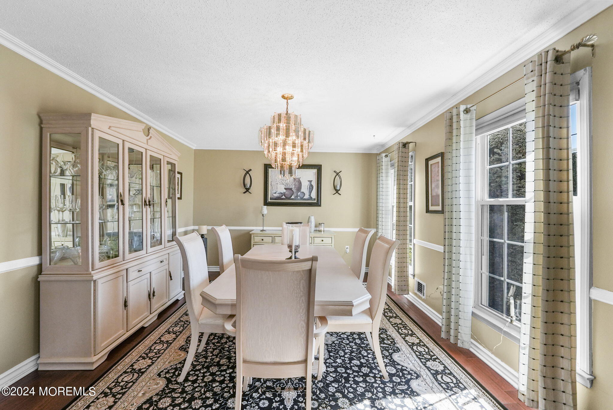762 Adelphia Road Freehold, NJ 07728 - Photo 8 of 56 a view of a dining room with furniture a rug and wooden floor