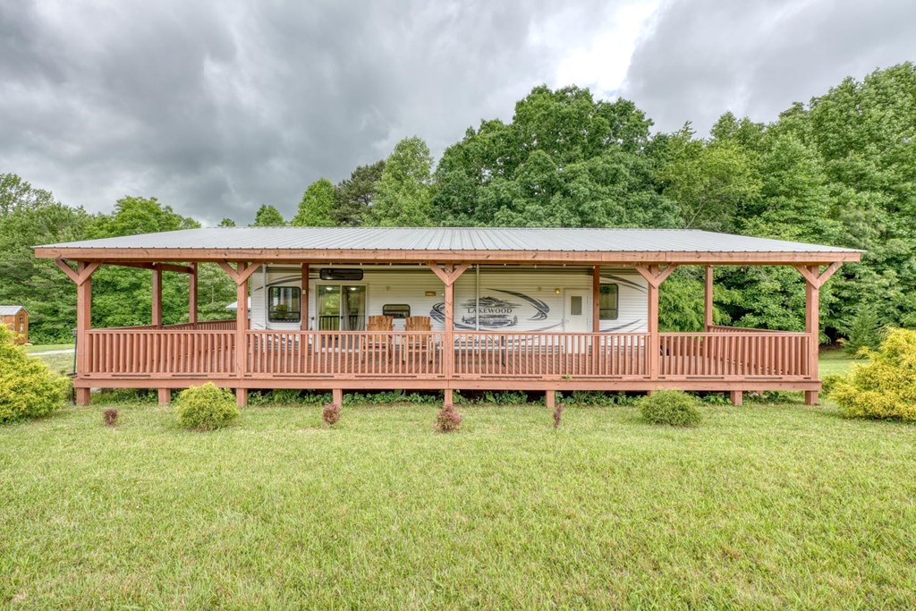 568 Parks Road Hiawassee, GA 30546 - Photo 29 of 38 a view of a house with a yard and sitting area