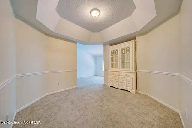 a view of empty room with a fireplace