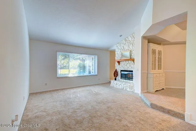 an empty room with windows and entrance