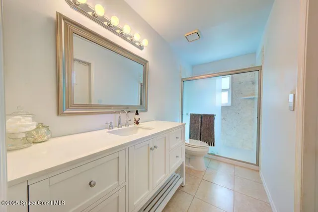 a bathroom with a double vanity sink and mirror