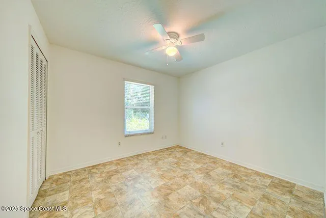 a view of empty room with windows