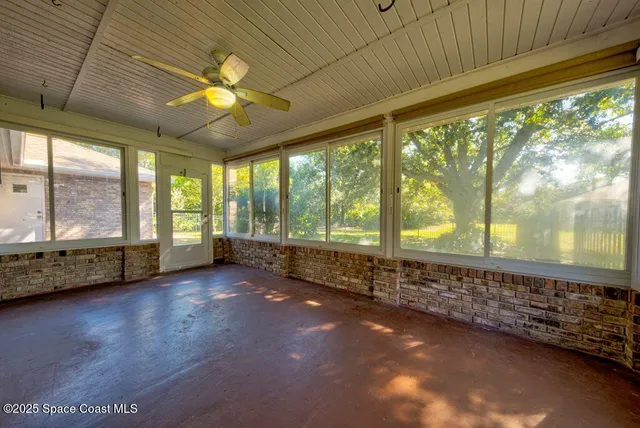 a kitchen with a refrigerator a sink and cabinets