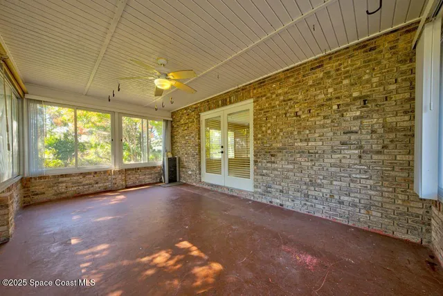a kitchen with a sink and wooden floor