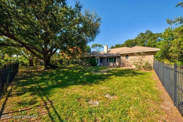 a bathroom with a granite countertop toilet sink and a mirror
