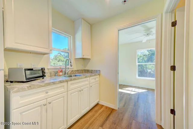 a view of a balcony with wooden floor