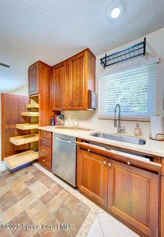 a kitchen with stainless steel appliances a refrigerator and cabinets