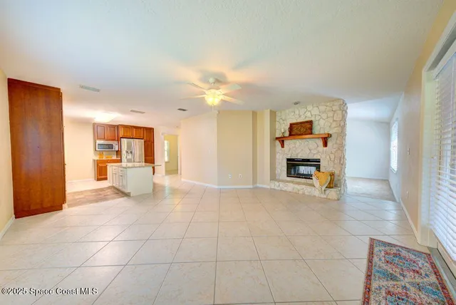 a view of a kitchen with a sink and a window