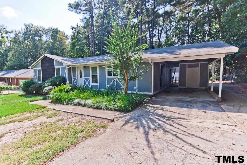 4305 Hopson Drive Raleigh, NC 27604 - Photo 13 of 14 Concrete driveway and carport.